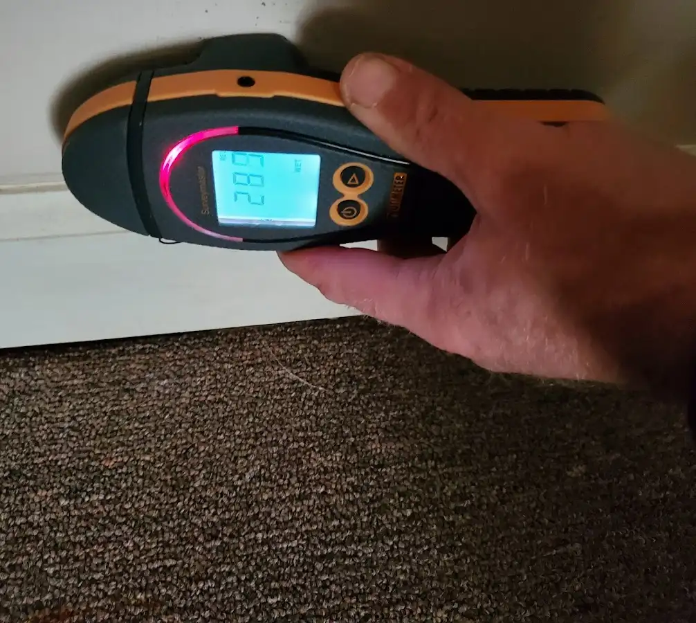 Moisture detection at baseboard during Storm Damage Restoration in Oakland